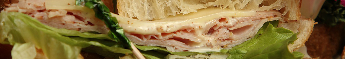 Eating Sandwich at Paradise Cafe restaurant in Honolulu, HI.